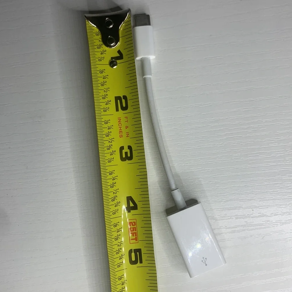 white MacBook adapter